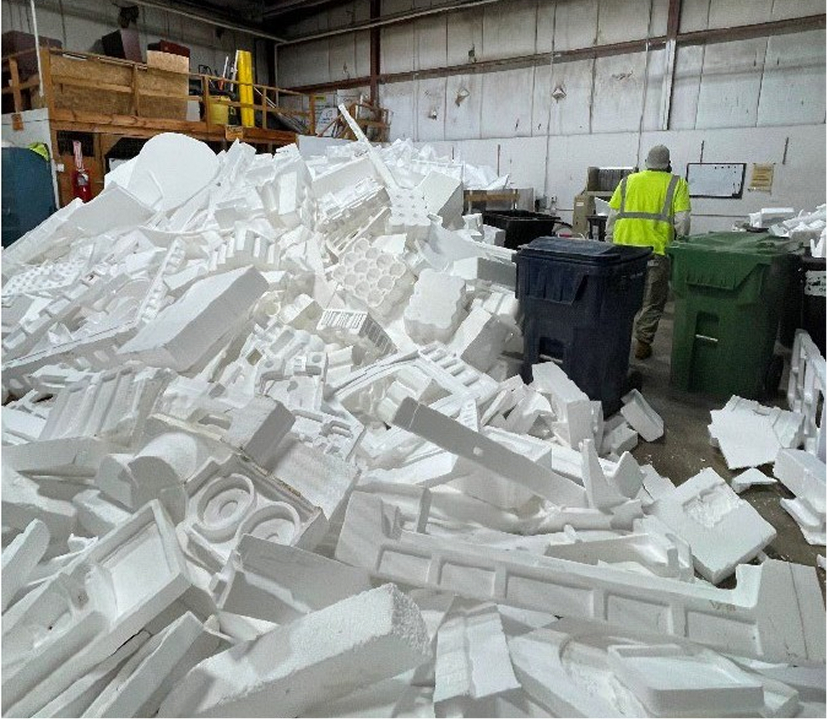 Large pile of foam packaging at a recycling facility